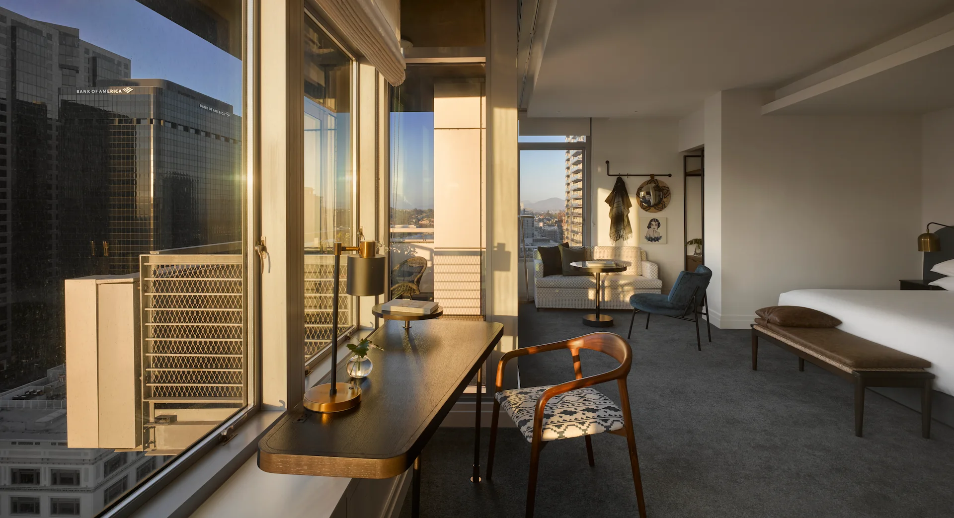 view from inside the living room, bedroom, and balcony of Room 1 King City View Balcony at Alma Hotel, San Diego, showcasing a stunning cityscape