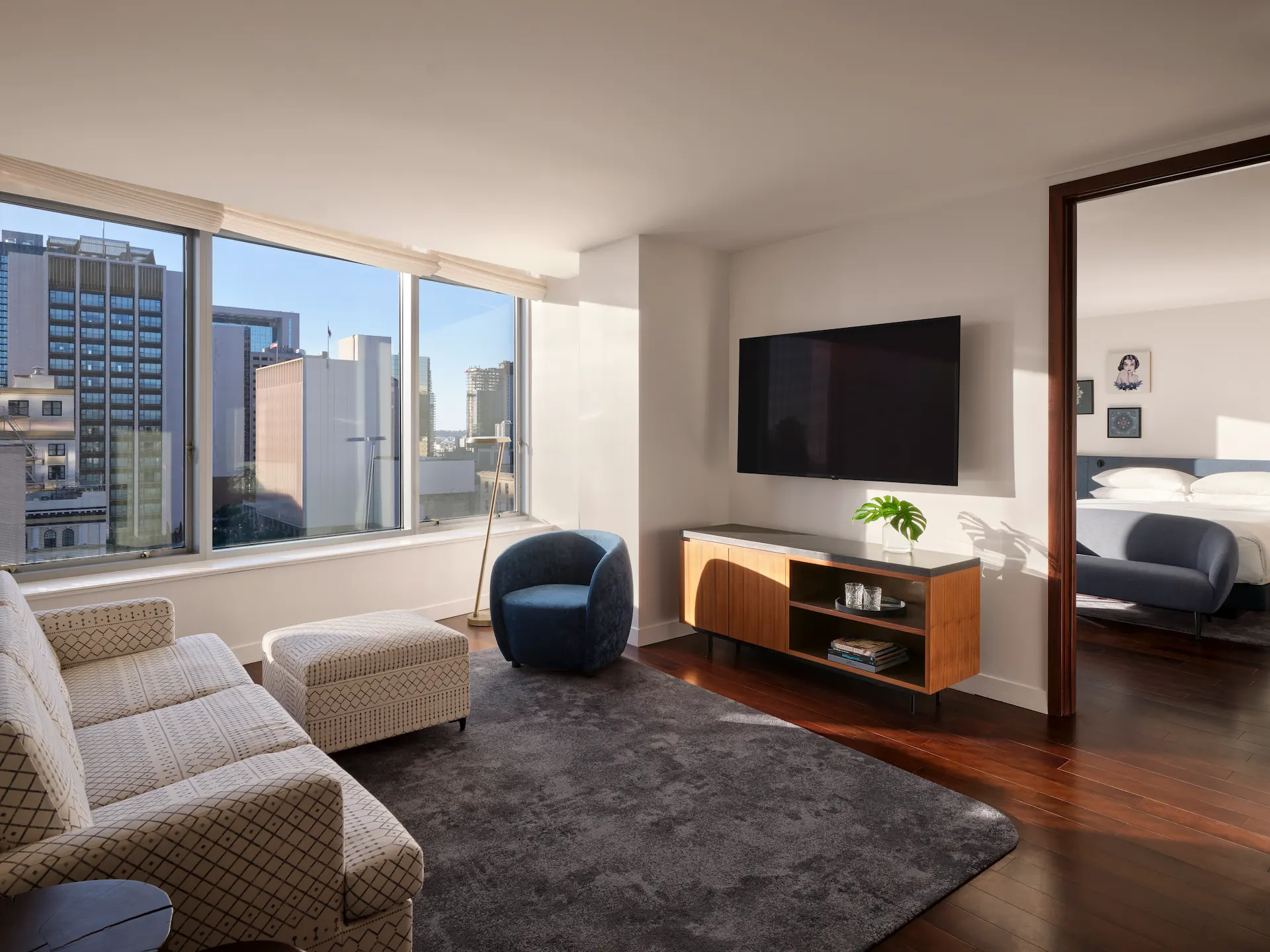 Living room and bedroom of the 1 Bedroom Spa Suite Balcony, showcasing elegant decor and spacious layout